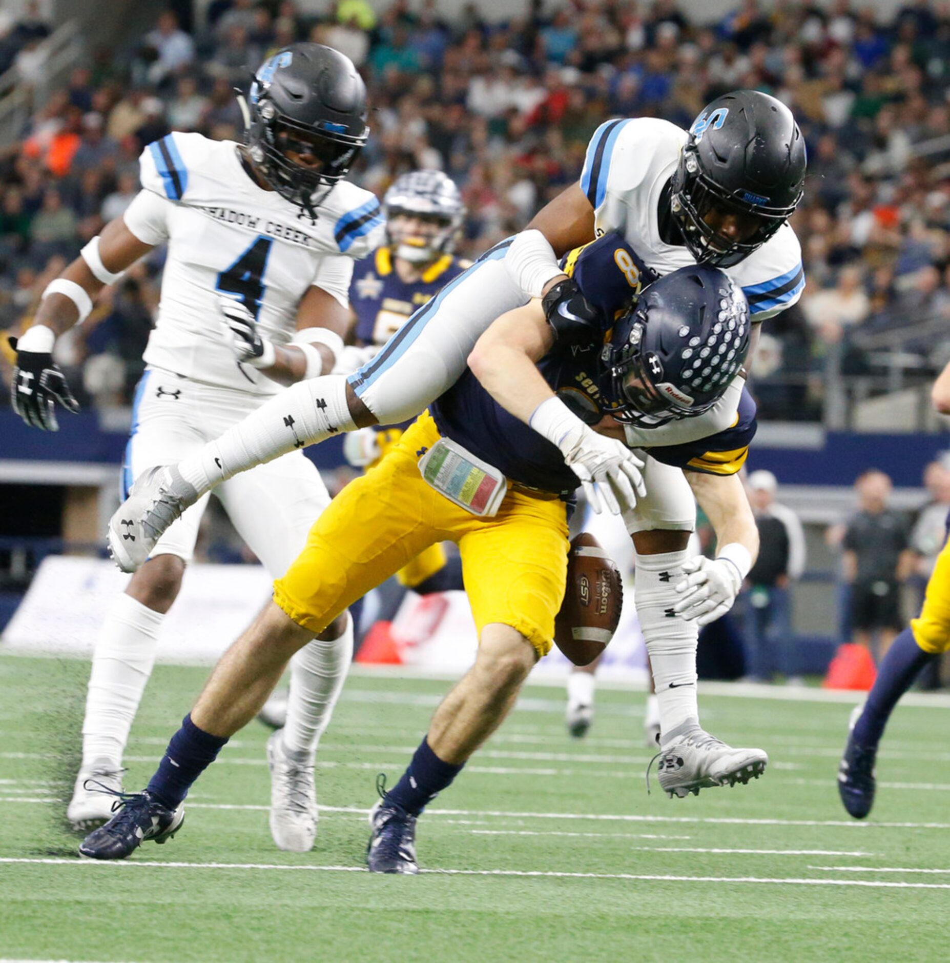 Shadow Creek's Jevin Murray (5) breaks up a pass intended for Highland Park's  Bennett Brown...