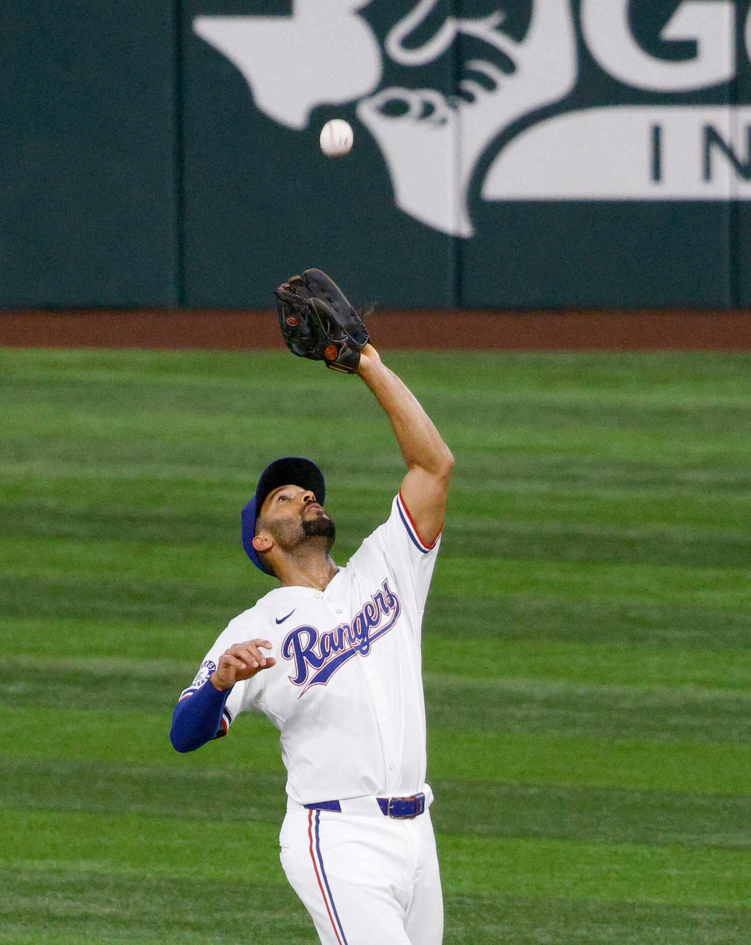 Texas Rangers second base Marcus Semien (2) catches a fly ball hit by Minnesota Twins...