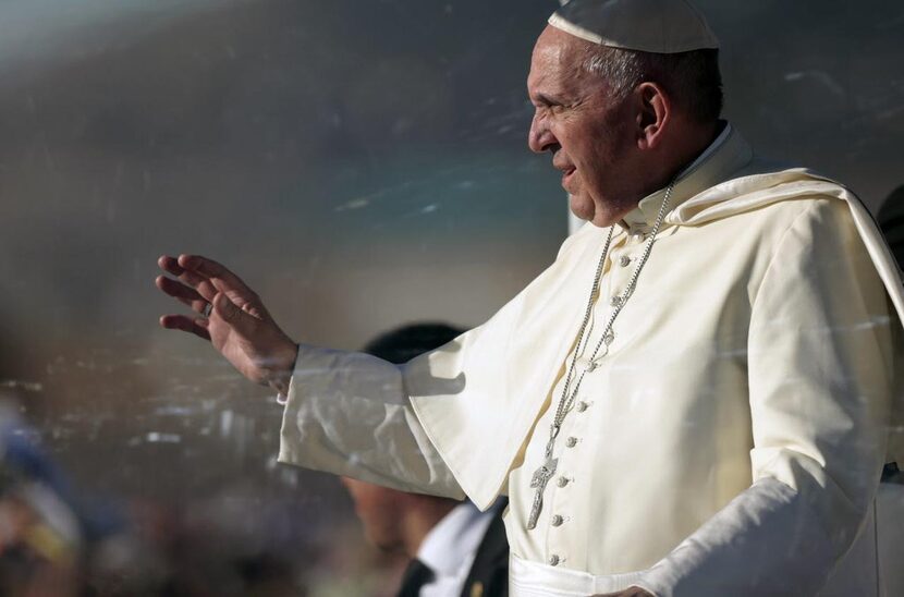 
Pope Francis waves from the popemobile in Ciudad Juarez, Mexico. Throngs gathered at...