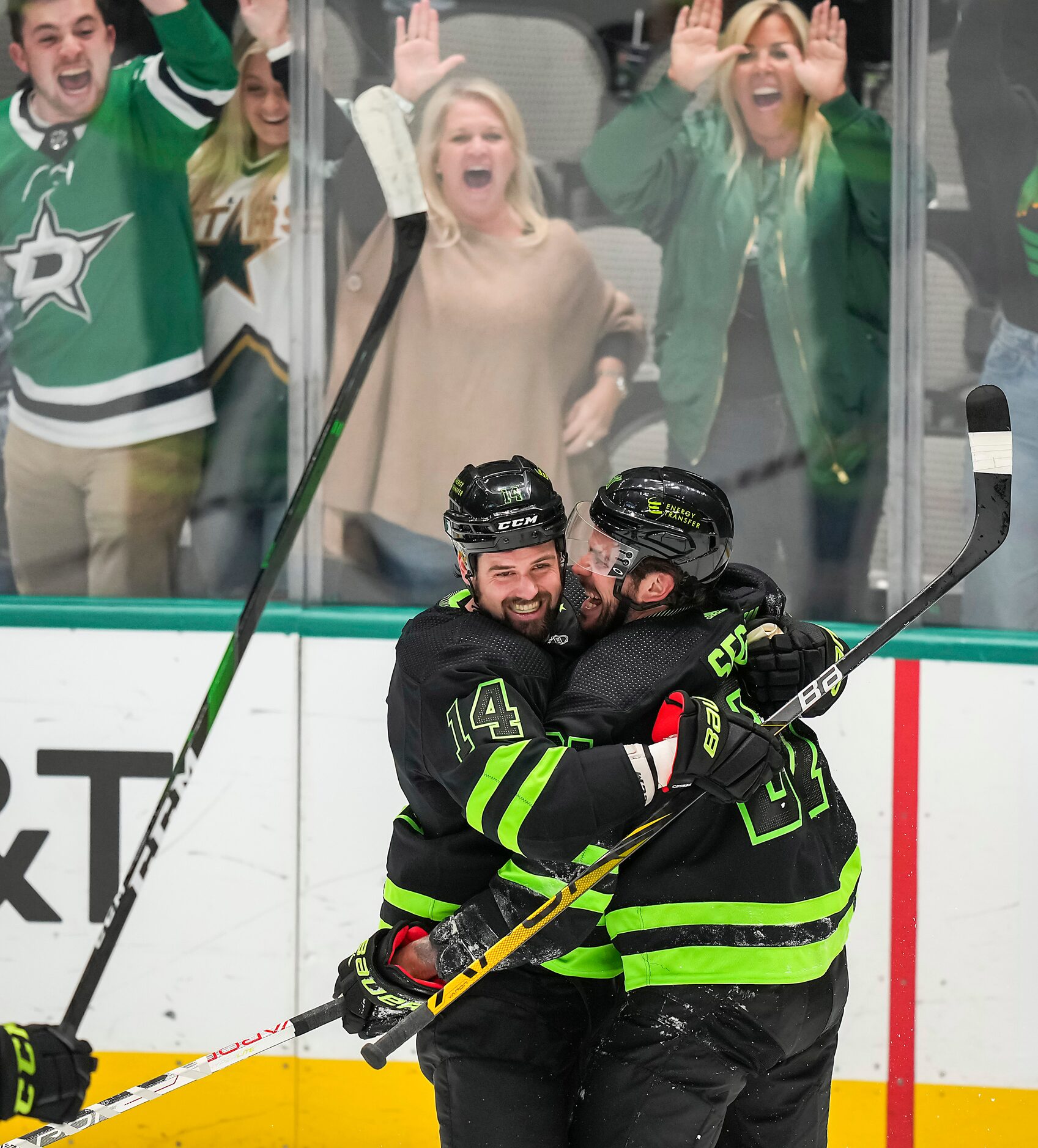 Dallas Stars center Tyler Seguin (91) celebrates with left wing Jamie Benn (14) after...