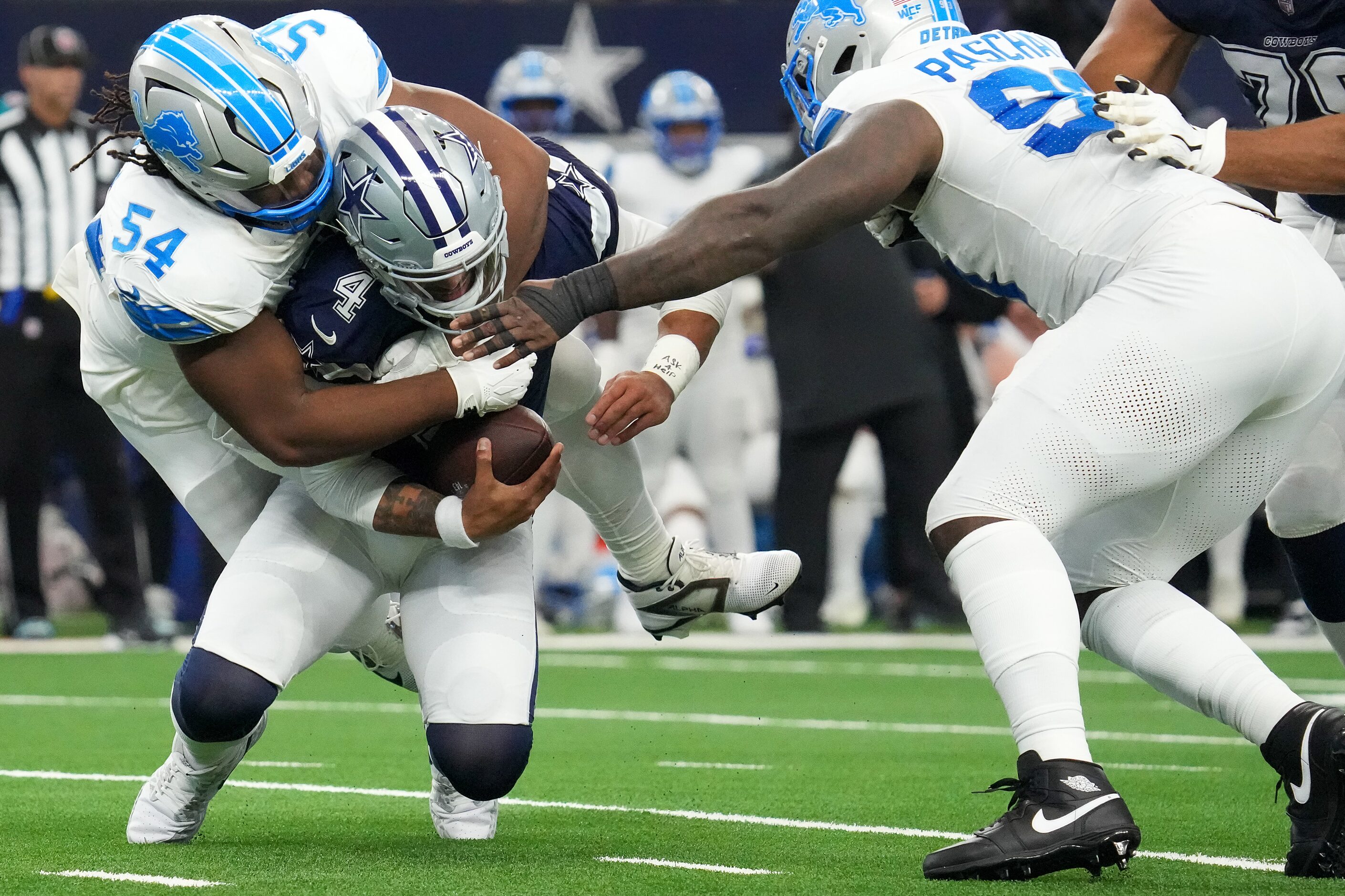 Dallas Cowboys quarterback Dak Prescott (4) is sacked by Detroit Lions defensive tackle Alim...