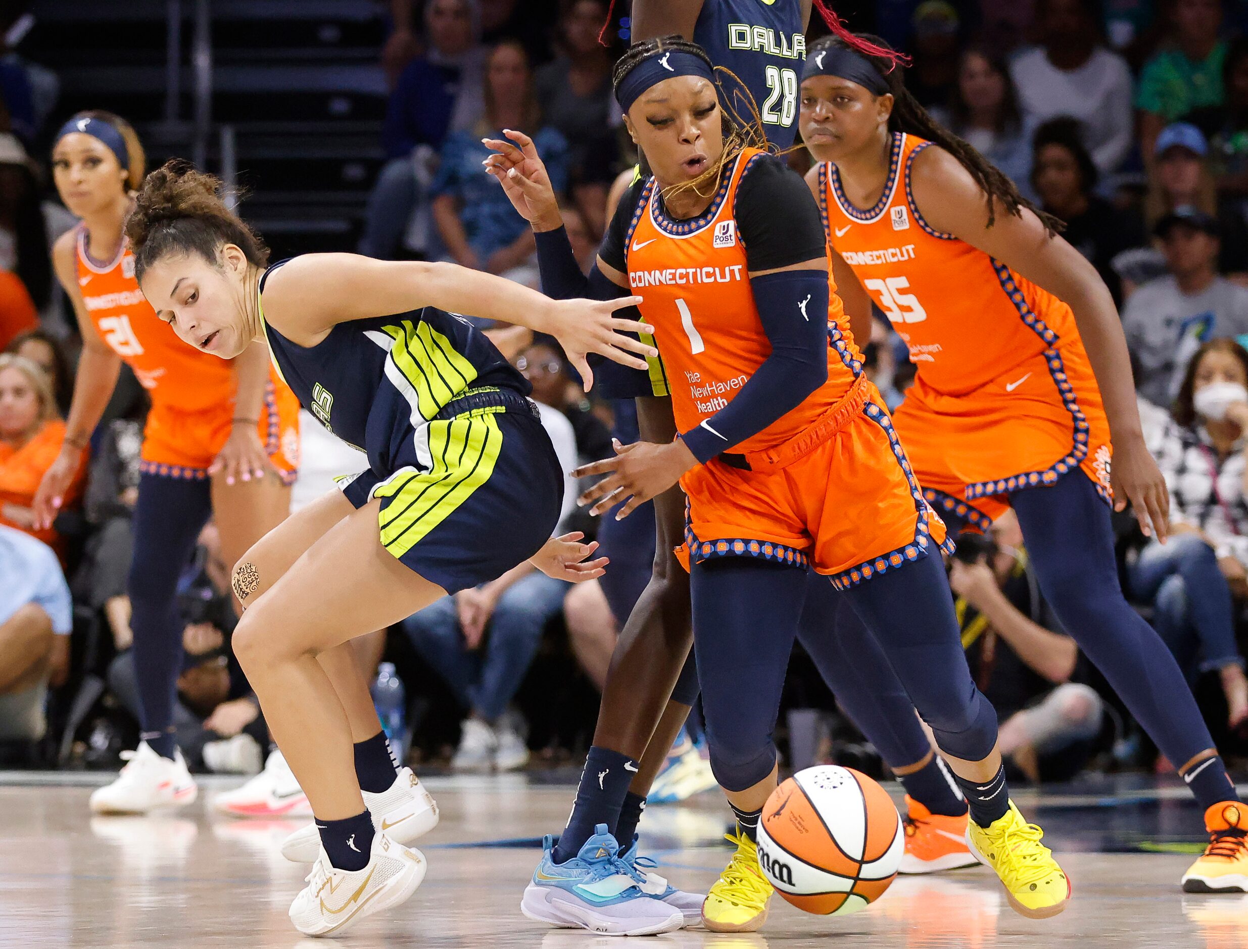 Dallas Wings guard Veronica Burton (12) turns the ball over to Connecticut Sun guard Odyssey...