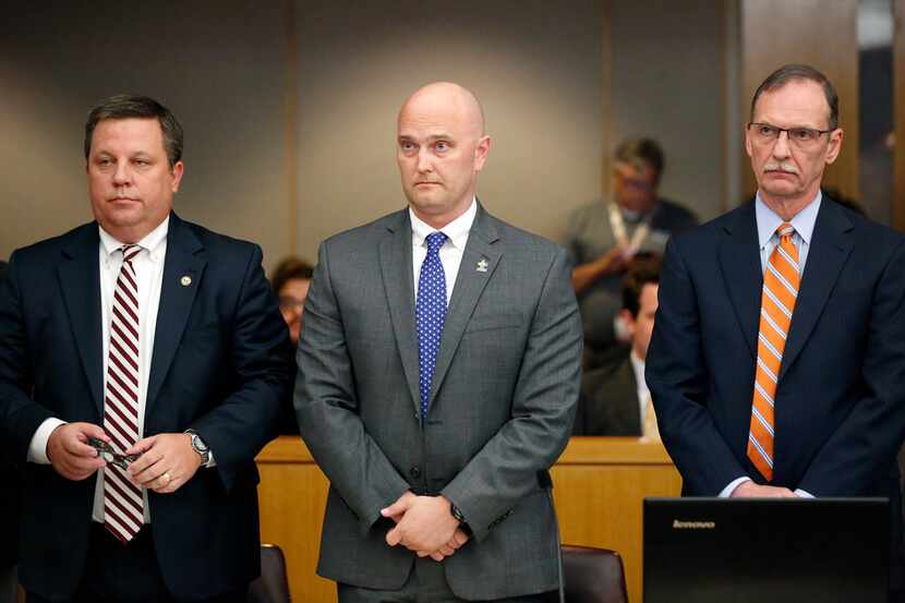 Fired Balch Springs police officer Roy Oliver was flanked by his attorneys Miles Brissette...