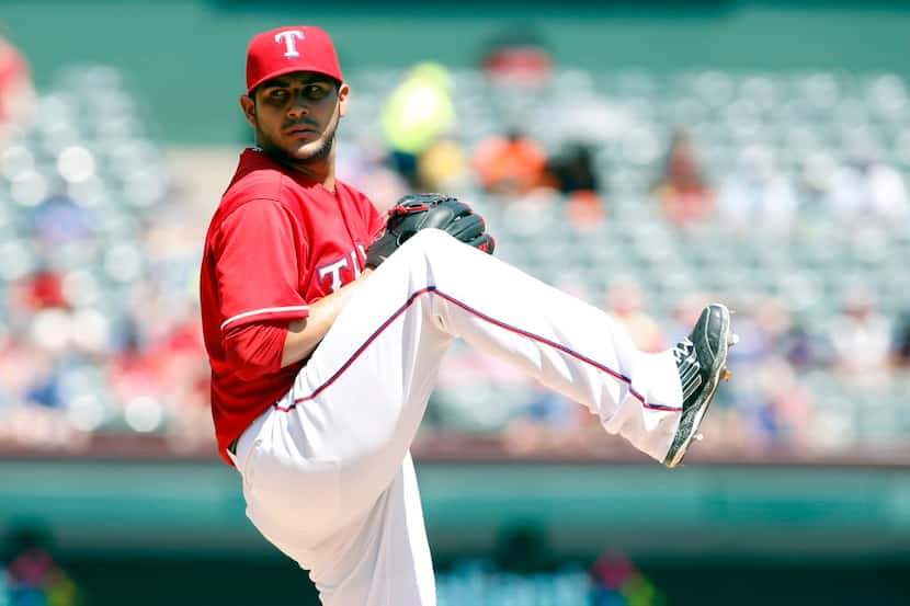 Aug 2, 2015; Arlington, TX, USA; Texas Rangers starting pitcher Martin Perez (33) pitches in...