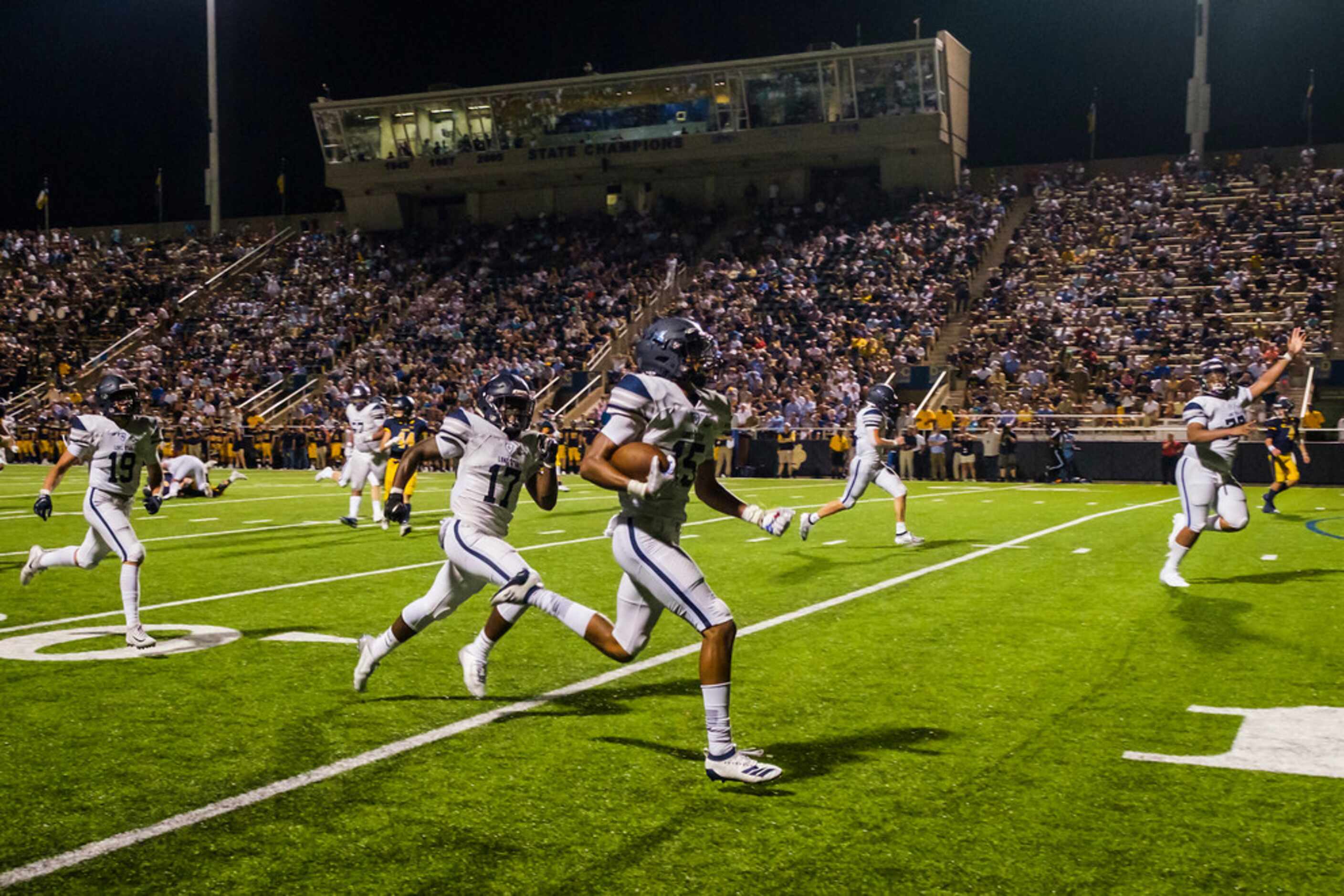 Frisco Lone Star safety Toren Pittman (15) returns an interception during the second half of...