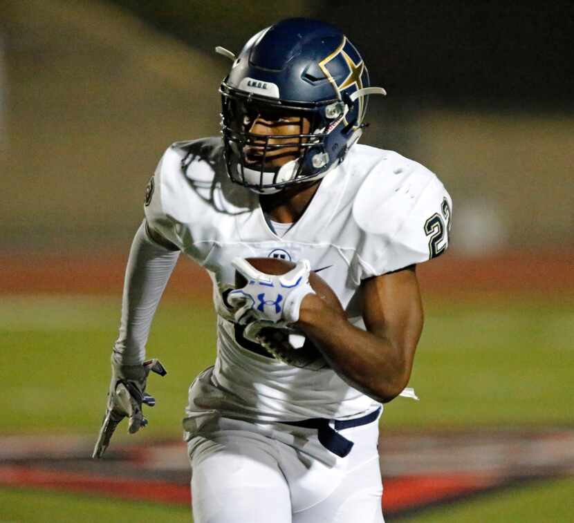 Jesuit running back EJ Smith carries the ball against Coppell on September 29, 2017....