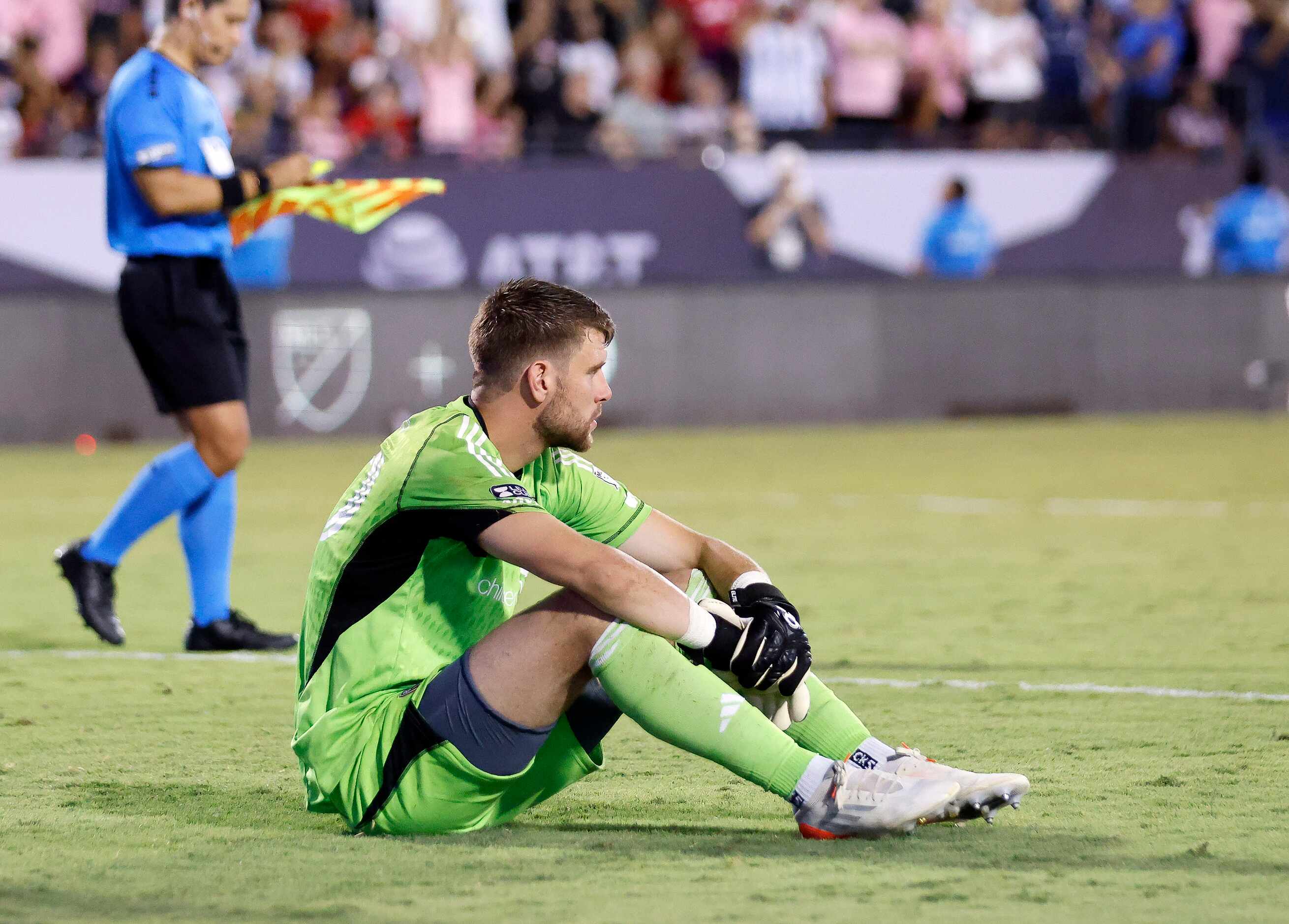 FC Dallas goalkeeper Maarten Paes (30) sits in front of the goal after Inter Miami...