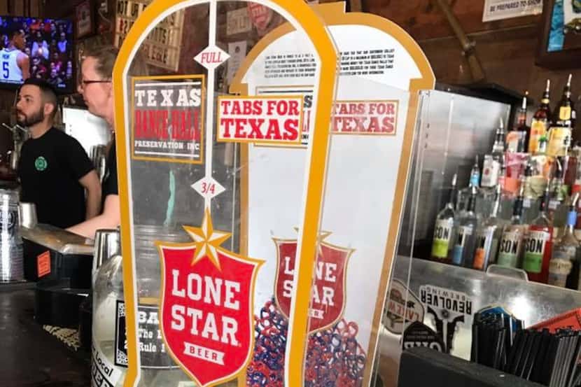 A Lone Star Beer boot on the bar of Truck Yard in 2017. The boot is part of a fundraiser for...