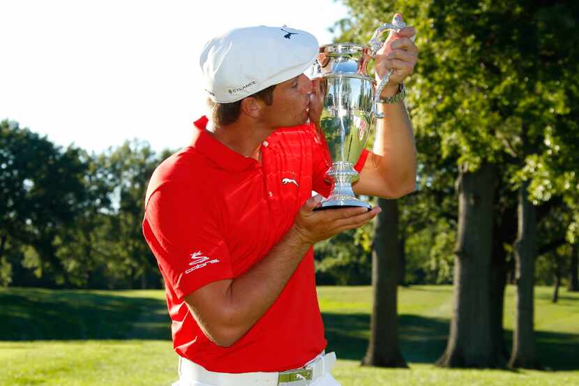 CLEVELAND, OH - SEPTEMBER 11: Bryson DeChambeau kisses the championship trophy after winning...