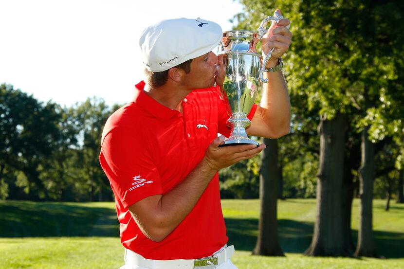 CLEVELAND, OH - SEPTEMBER 11: Bryson DeChambeau kisses the championship trophy after winning...