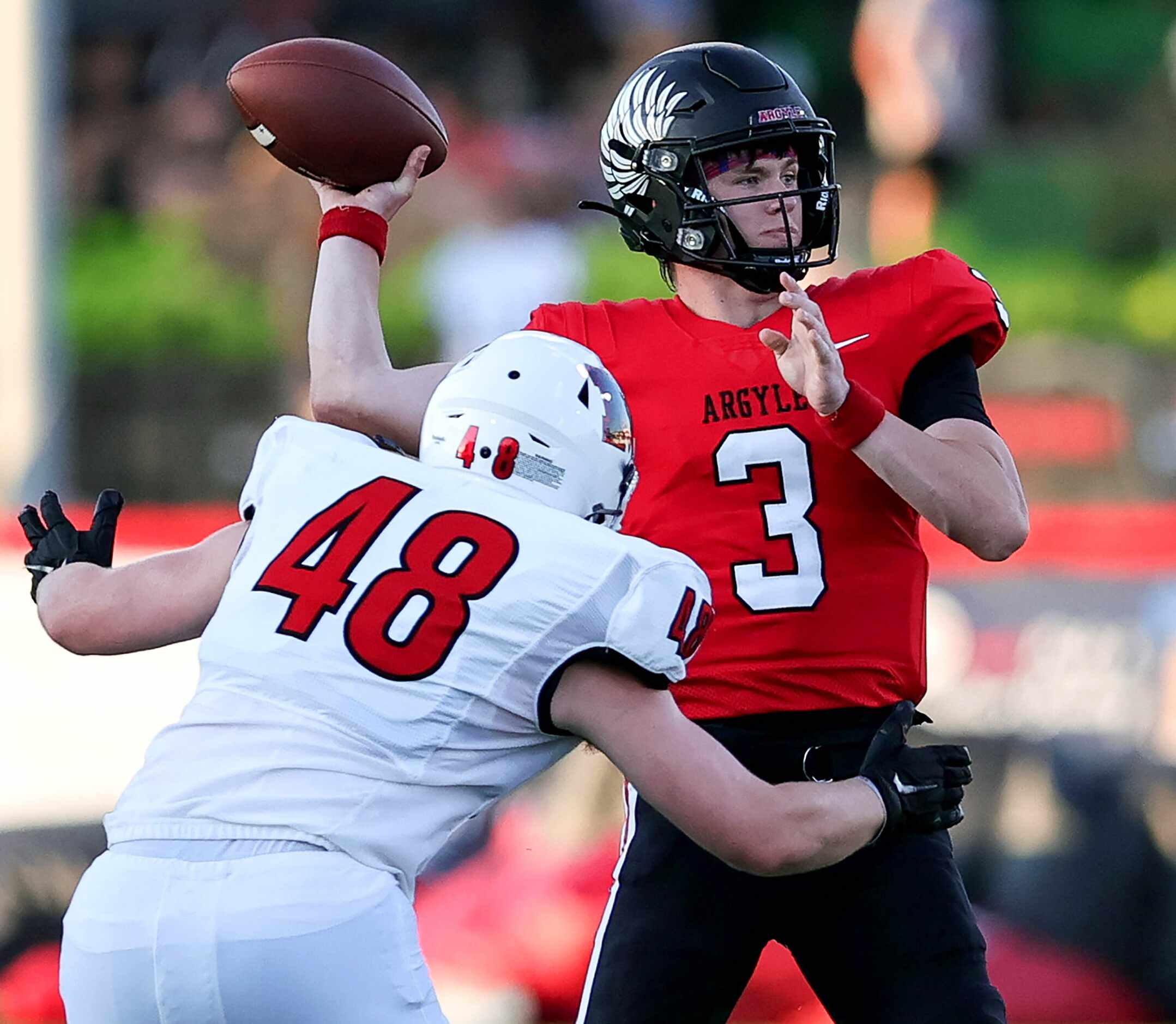 Argyle quarterback Jacob Robinson (3) tries to get off a pass against Melissa's Lance Riley...