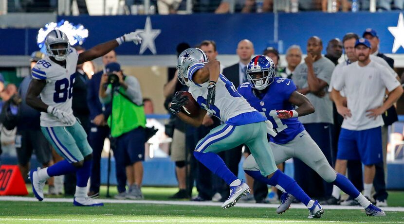 Dallas Cowboys wide receiver Terrance Williams (83) is chased by New York Giants cornerback...