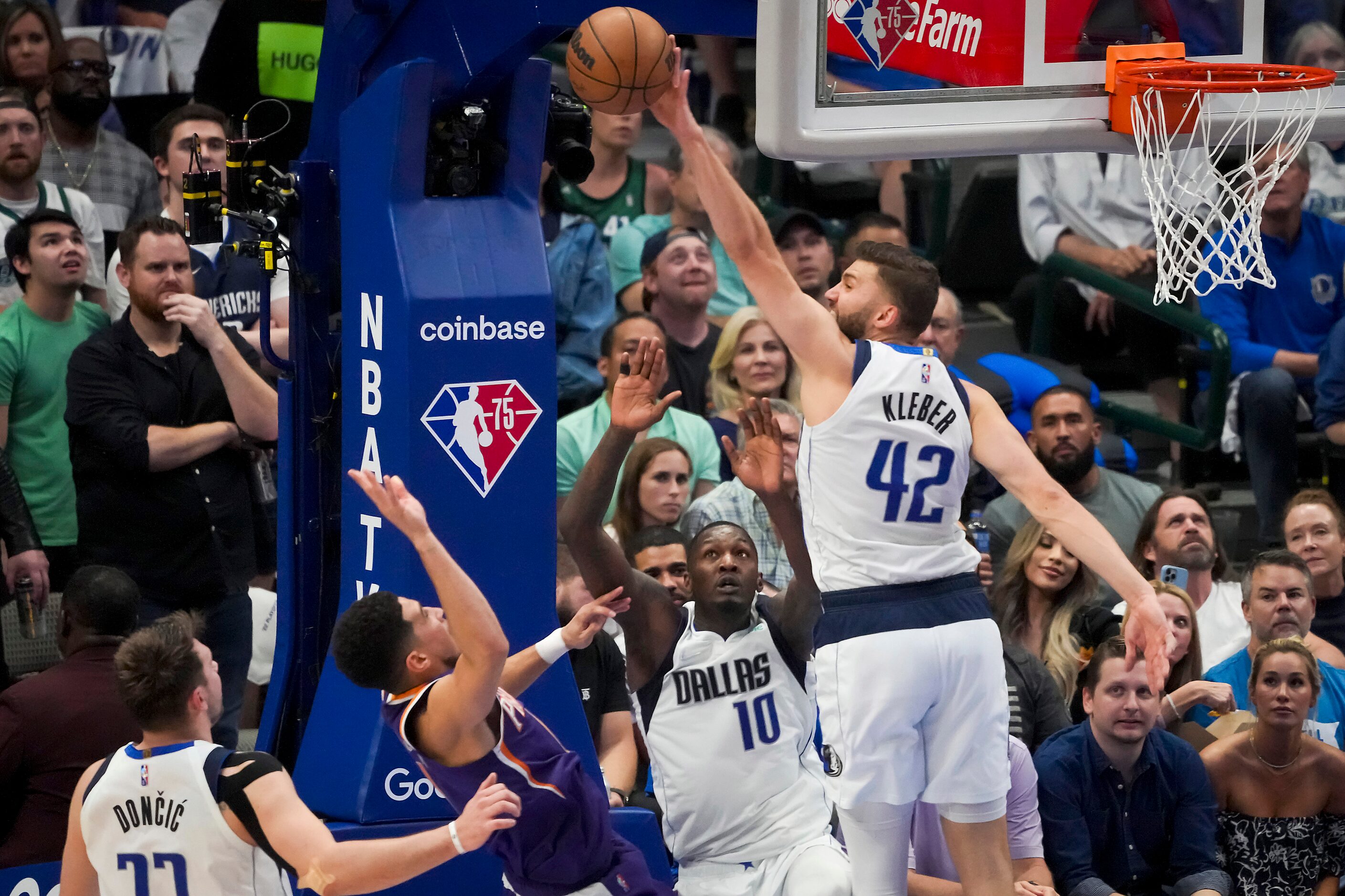 Dallas Mavericks forward Maxi Kleber (42) blocks a shot by Phoenix Suns guard Devin Booker...