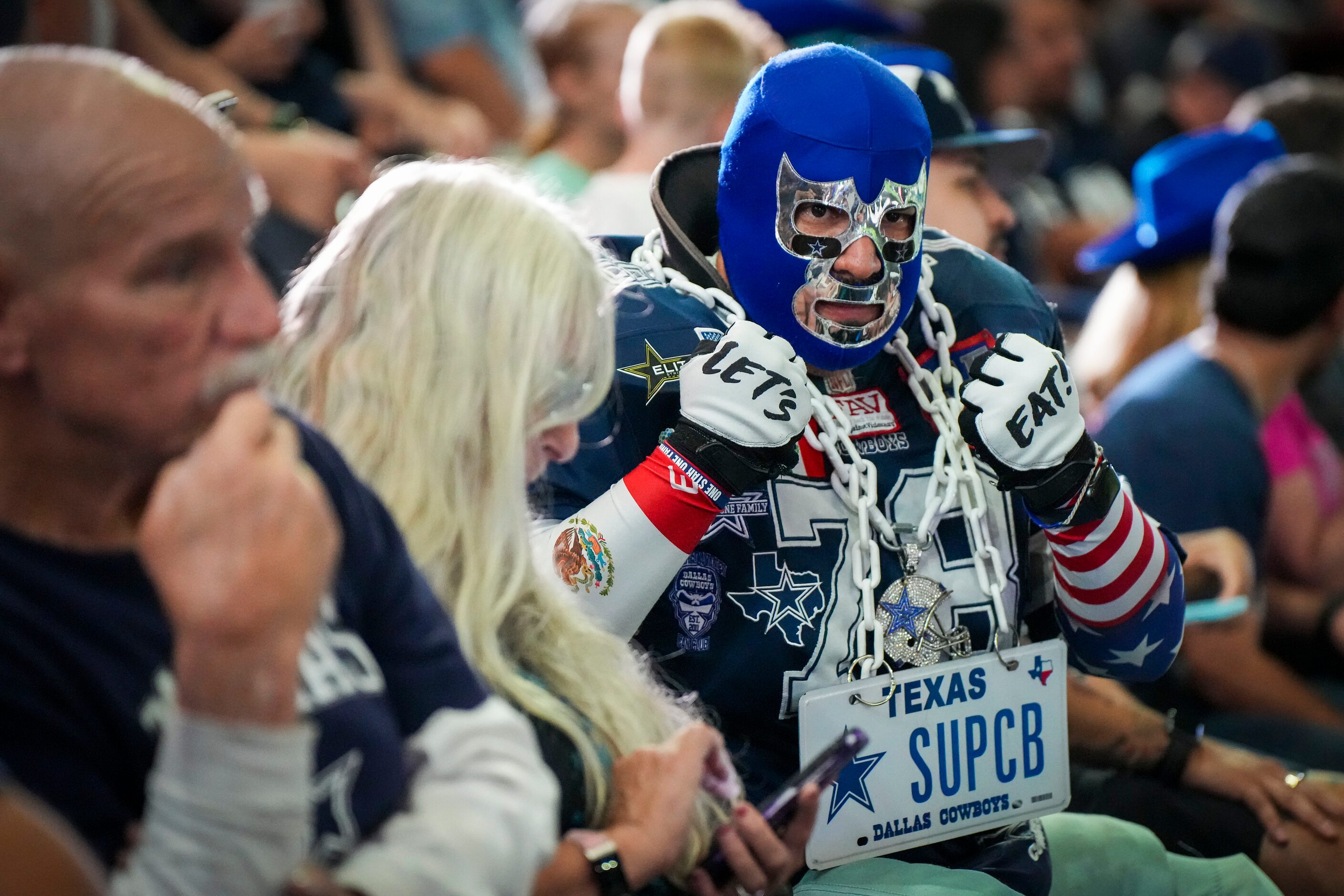 Dallas Cowboys fan Miguel Castellanos waits for the opening ceremony for a Cowboys open...