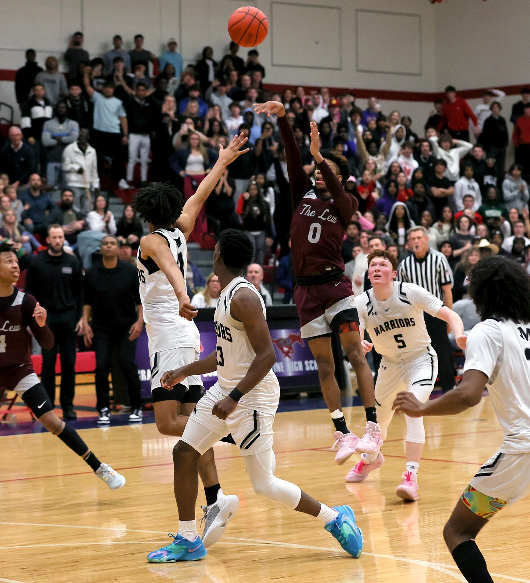 Lewisville guard Adrian Banks (0) attempts a three point shot for the win against Arlington...