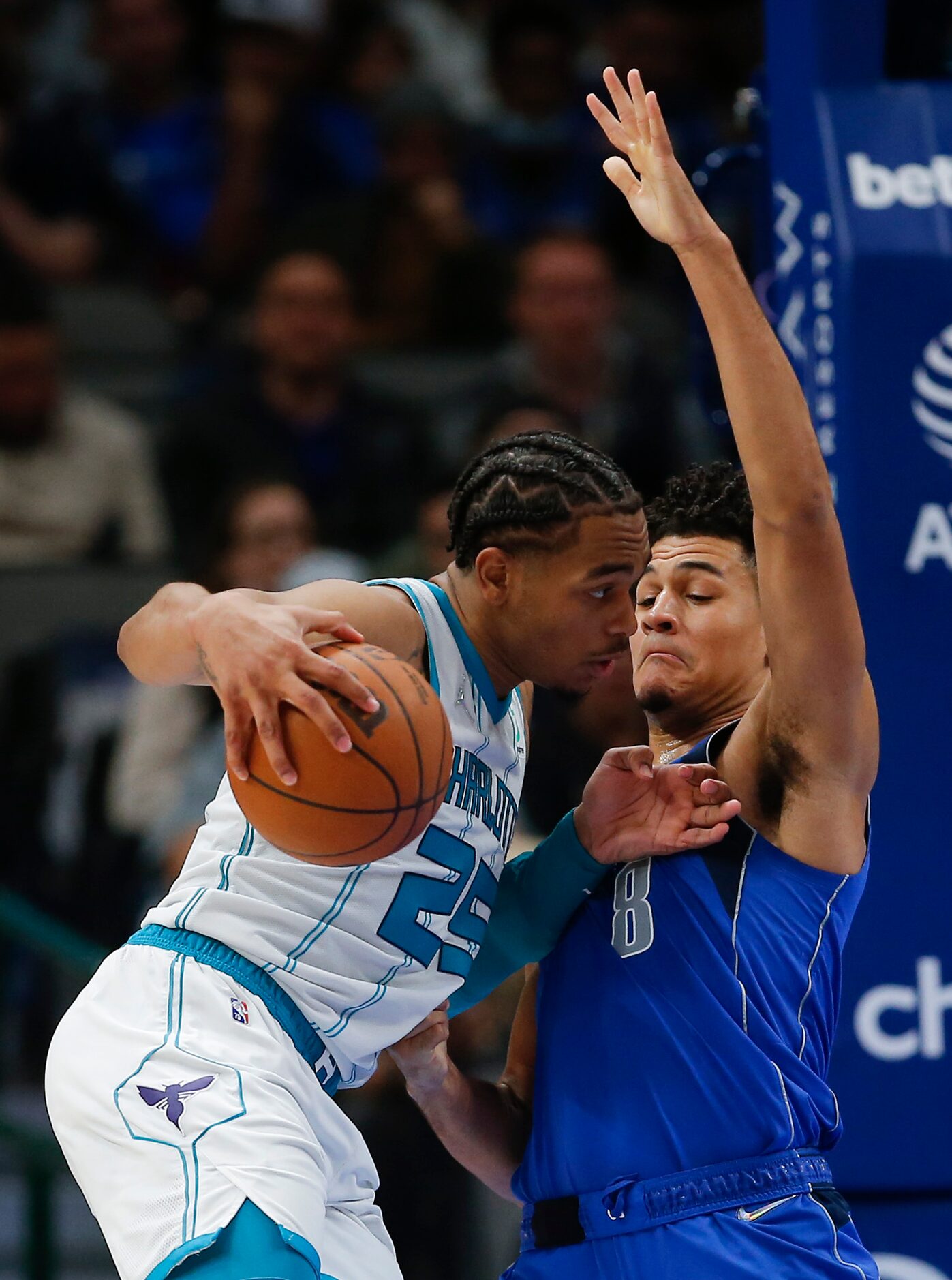 Charlotte Hornets forward P.J. Washington (25) battles Dallas Mavericks guard Josh Green (8)...