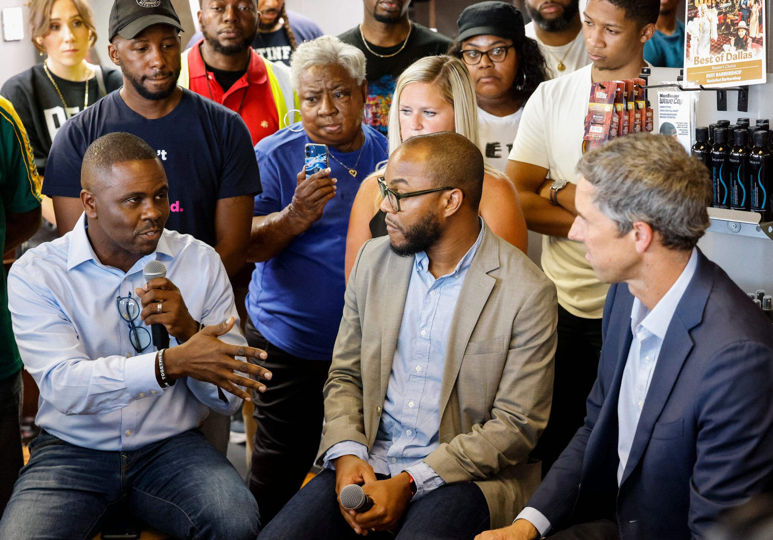 Patrons asks questions to Texas Governor candidate Beto O'Rourke, right, as he campaigns at...