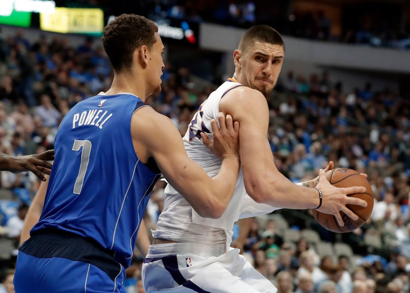 Dallas Mavericks' Dwight Powell (7) defends as Phoenix Suns center Alex Len makes a move to...