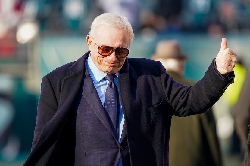 Dallas Cowboys owner Jerry Jones gives a thumbs up to fans before an NFL football game...
