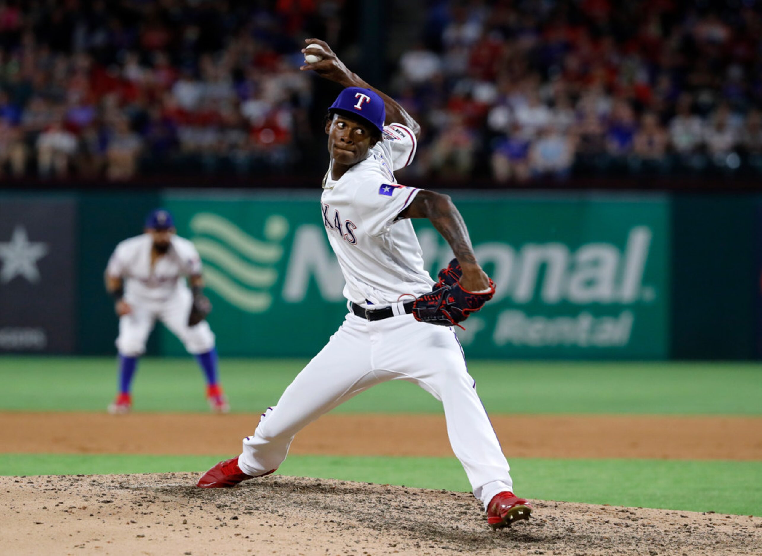 Texas Rangers relief pitcher Phillips Valdez throws to a Los Angeles Angels batter during...