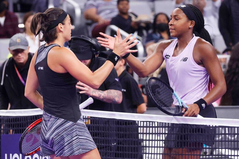 Coco Gauff of the USA, right, shakes hand with Caroline Garcia of France after their game on...