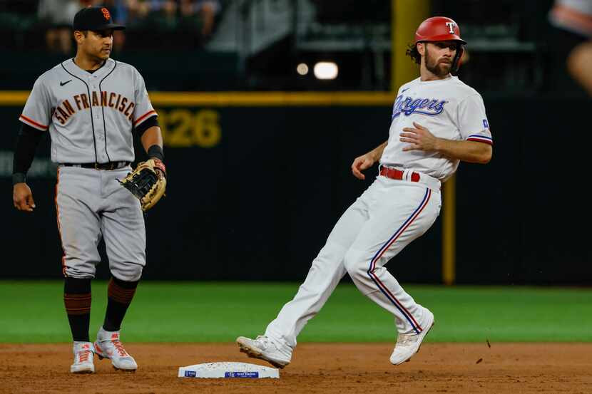 Texas Rangers shortstop Charlie Culberson (2) steals second base during the bottom of the...
