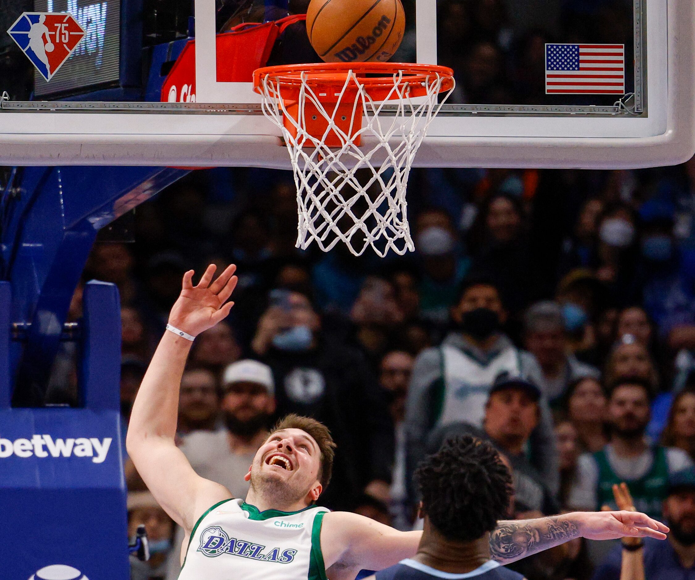 Dallas Mavericks guard Luka Doncic (77) smiles after finishing a layup during the fourth...