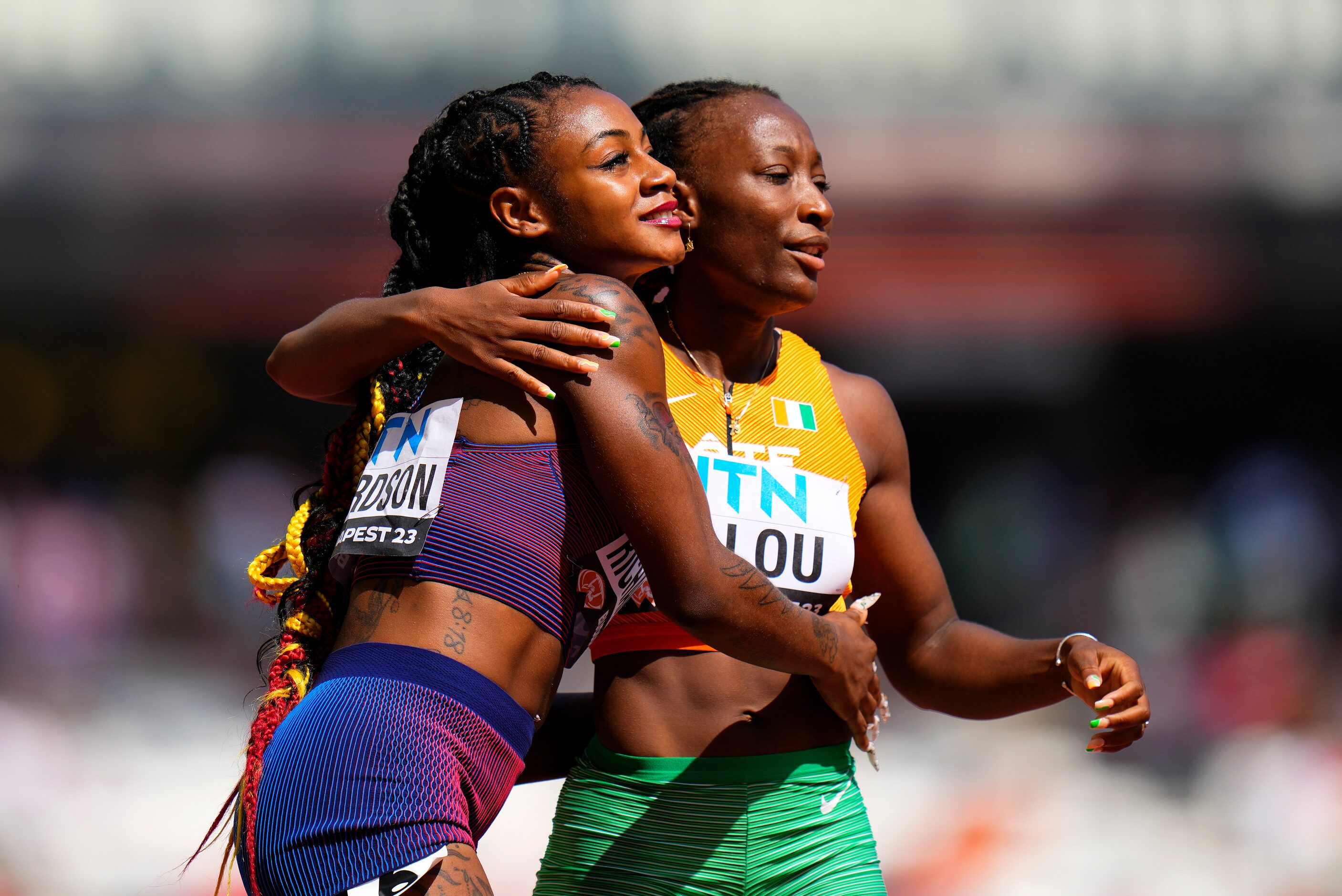 Sha'Carri Richardson, of the United States and Marie-Josee Ta Lou, of The Ivory Coast...