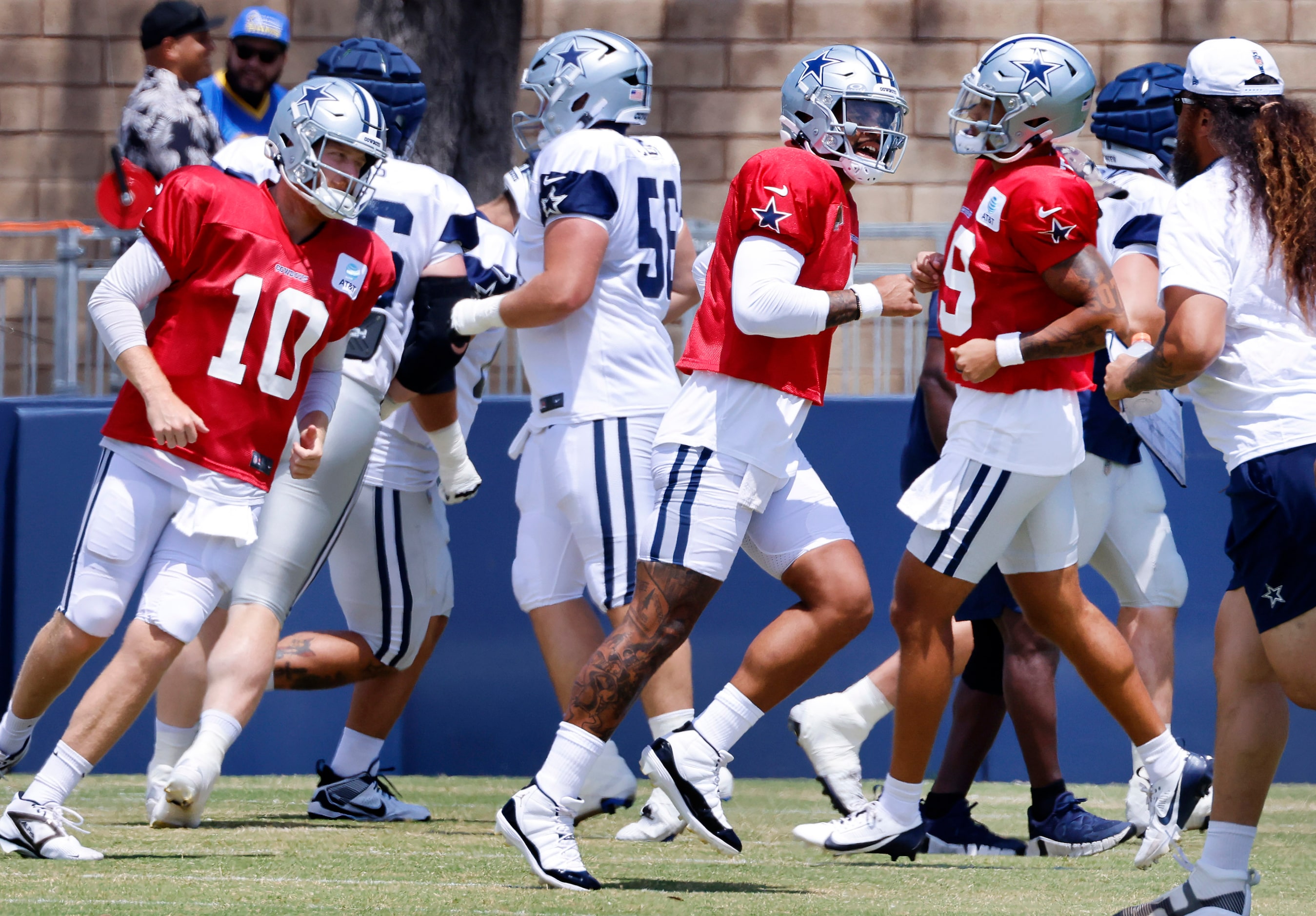 Dallas Cowboys quarterbacks Cooper Rush (10), Dak Prescott (4) and Trey Lance (19) warm up...