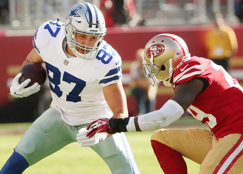 Dallas Cowboys tight end Geoff Swaim (87) attempts to avoid a tackle from San Francisco...