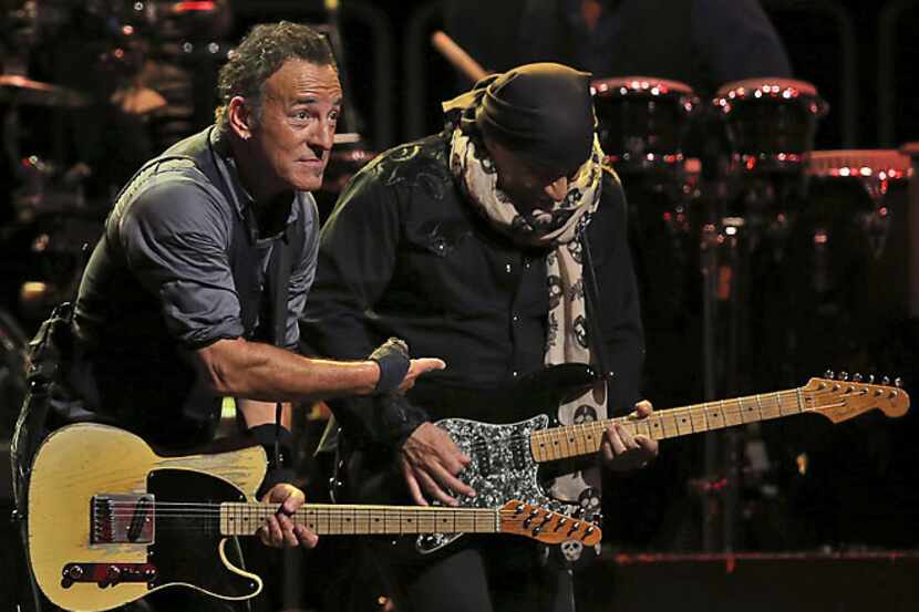 Bruce Springsteen, left, performs with the E Street Band on stage in Sydney Wednesday, Feb....