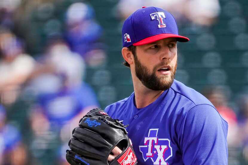 Texas Rangers pitcher Jordan Lyles delivers during the third inning of a spring training...