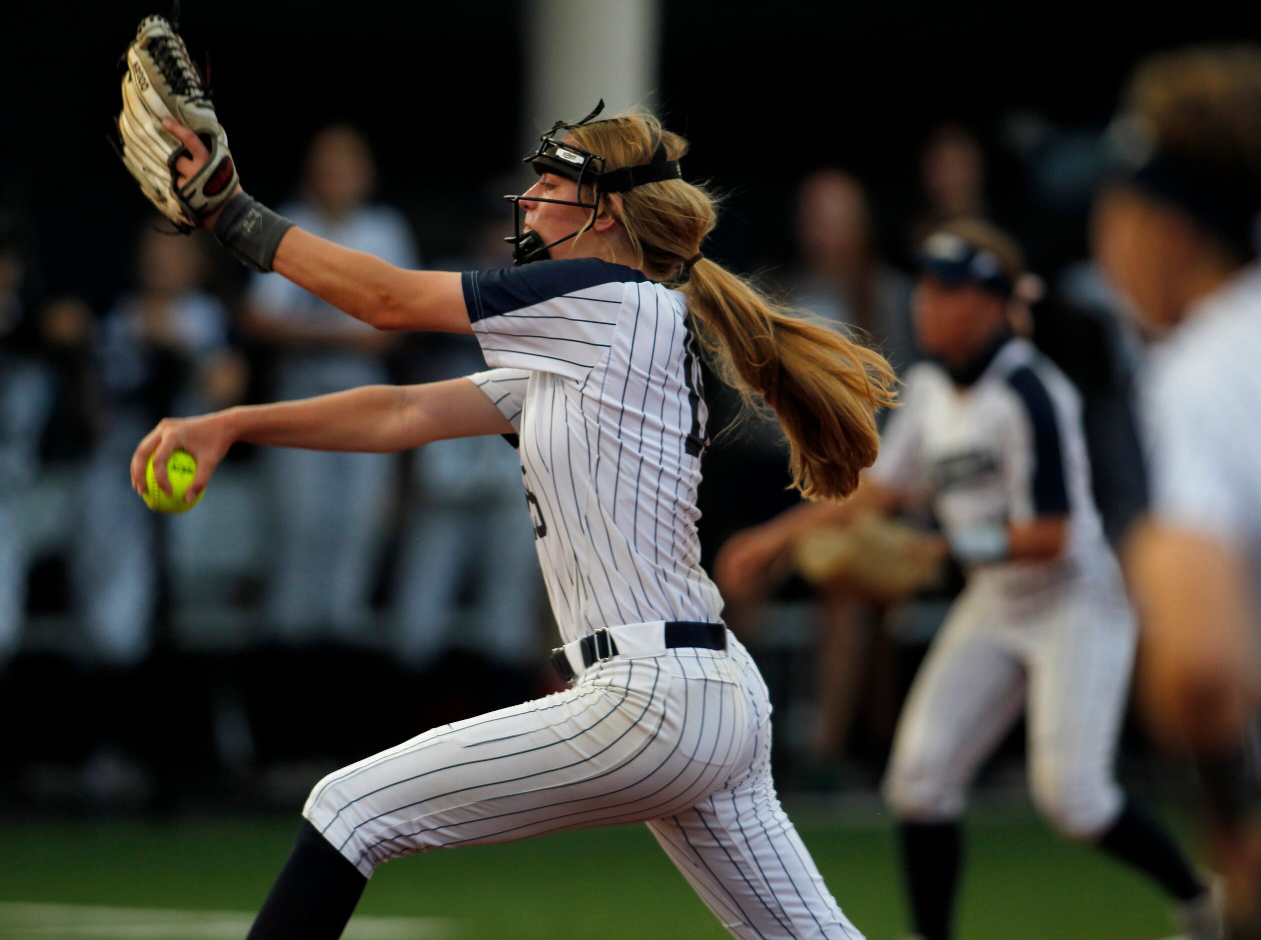 Flower Mound pitcher Landrie Harris (15) delivers a pitch to a Deer Park batter during the...