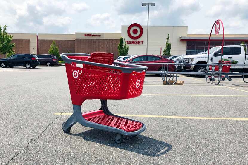 In this June 2019 file photo, a shopping cart sits in the parking lot of a Target store in...