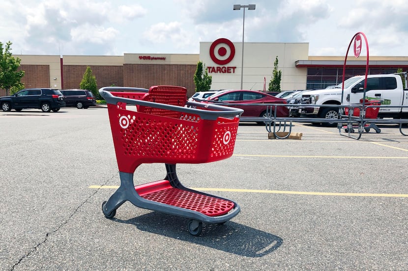 In this June 2019 file photo, a shopping cart sits in the parking lot of a Target store in...