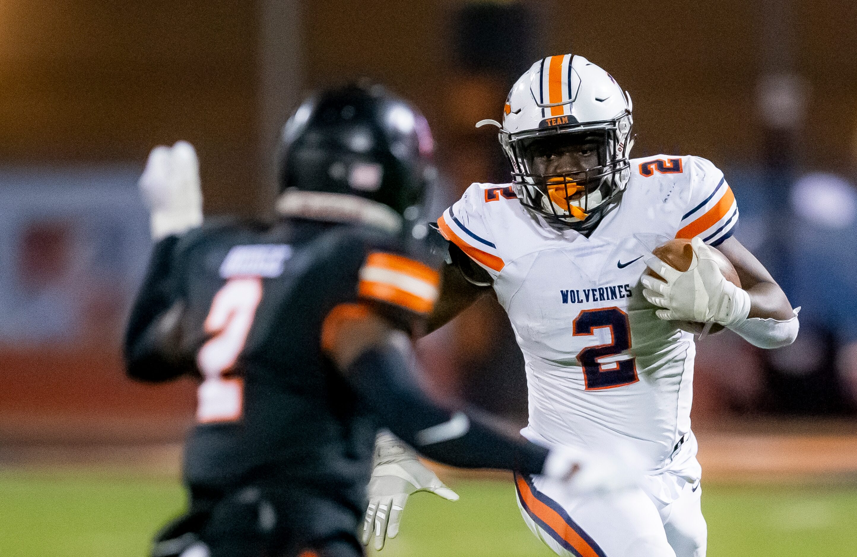 Wakeland junior running back Jared White, right, looks for room against Lancaster senior...