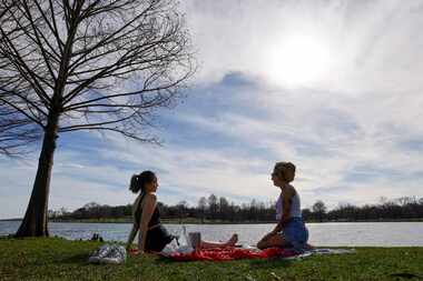 Ashlyn Colette (left) and Scarlett McPherson talk after having lunch along the water at...
