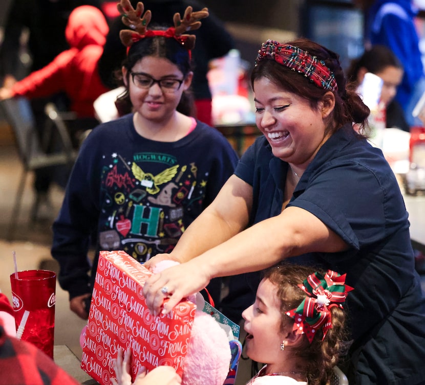 Ronald Villatoro's daughter Evelynn (center), and his wife, Jennifer Vasquez, who works at...