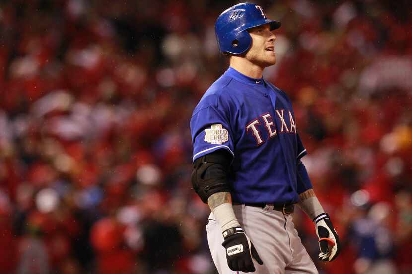 Texas Rangers left fielder Josh Hamilton (32) reacts after he flied out to end the 8th...