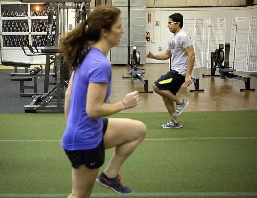 
Jillian Koerber and Justin Joseph take part in a strength and conditioning class at East...