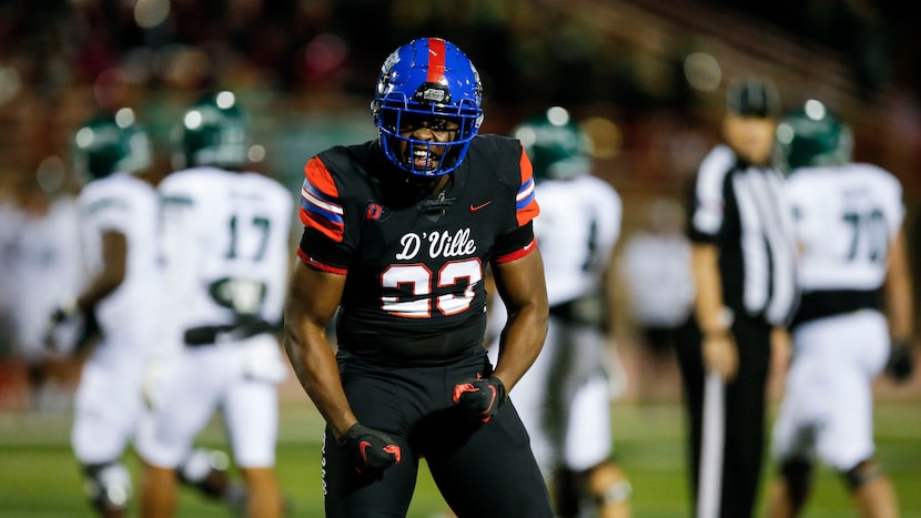 Duncanville senior defensive lineman Omari Abor (23) celebrates a Waxahachie fumble and...