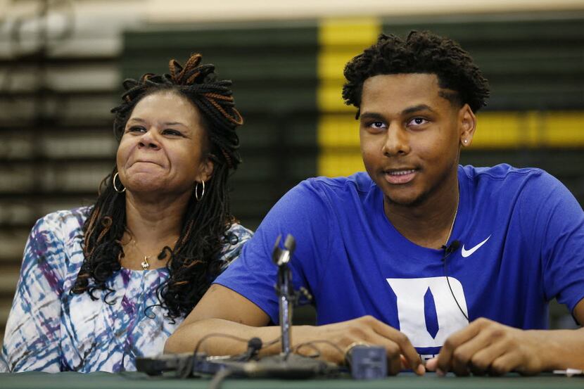 DeSoto basketball player Marques Bolden speaks to the media with his mother, Carolyn Bolden,...
