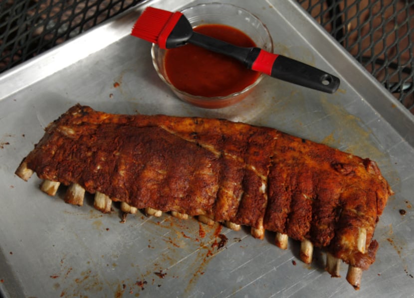 Grilling for the impatient: A rack of ribs out of the oven ready for the grill.