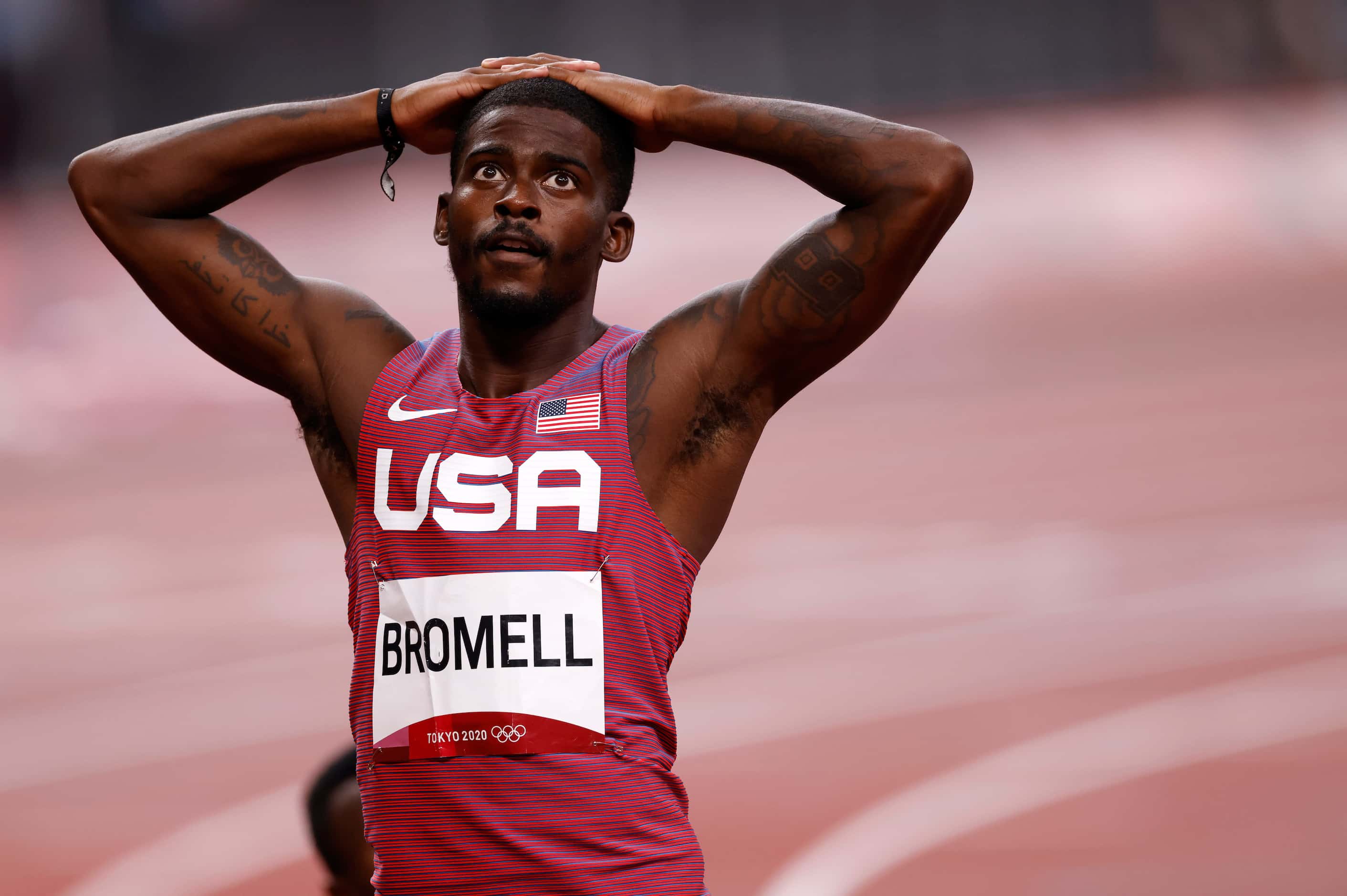 USA’s Trayvon Bromell waits for the official time for his run in the men’s 100 meter...