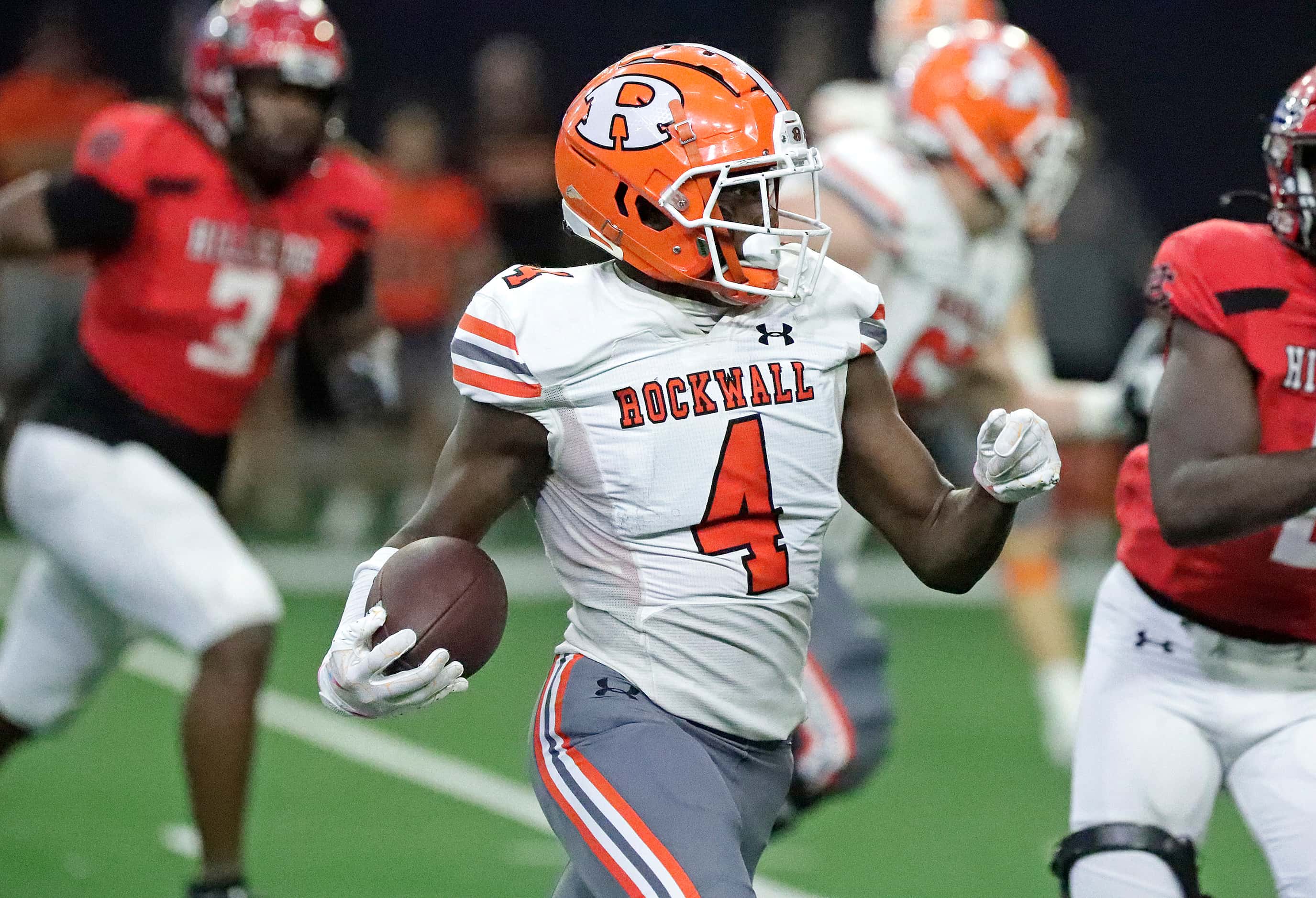 Rockwall High School wide receiver Camron Marsh (4) runs the football during the first half...