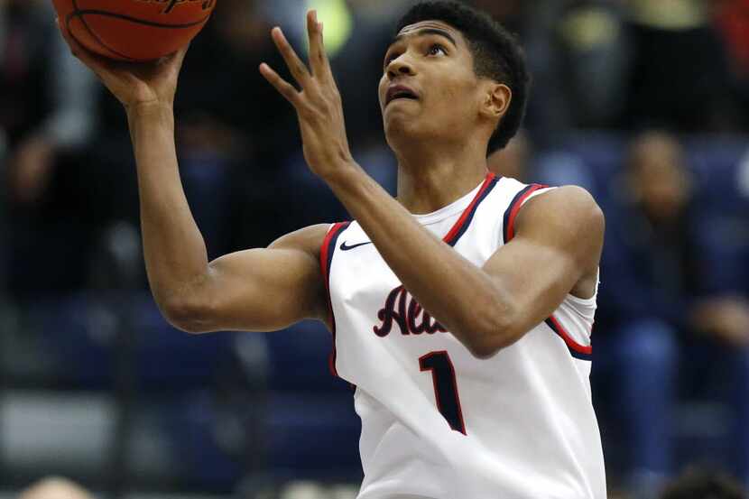 Allen forward Cam Christon (1) goes up for a lay up in the first quarter as Allen High...