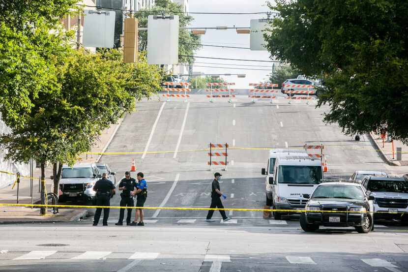 Austin police blocked off parts of Sixth Street after two shootings downtown early Sunday.