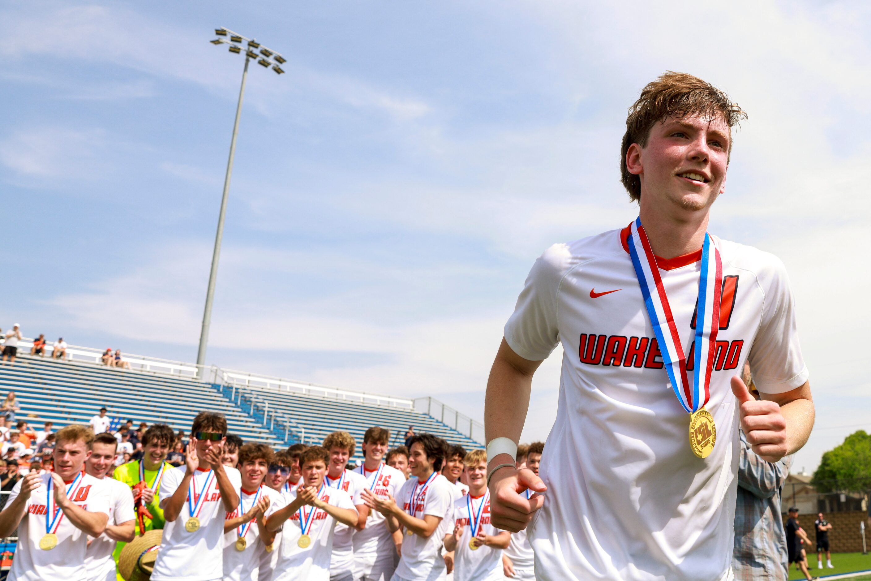 Frisco Wakeland forward William Heidman (11) jogs to accept the MVP award after winning the...