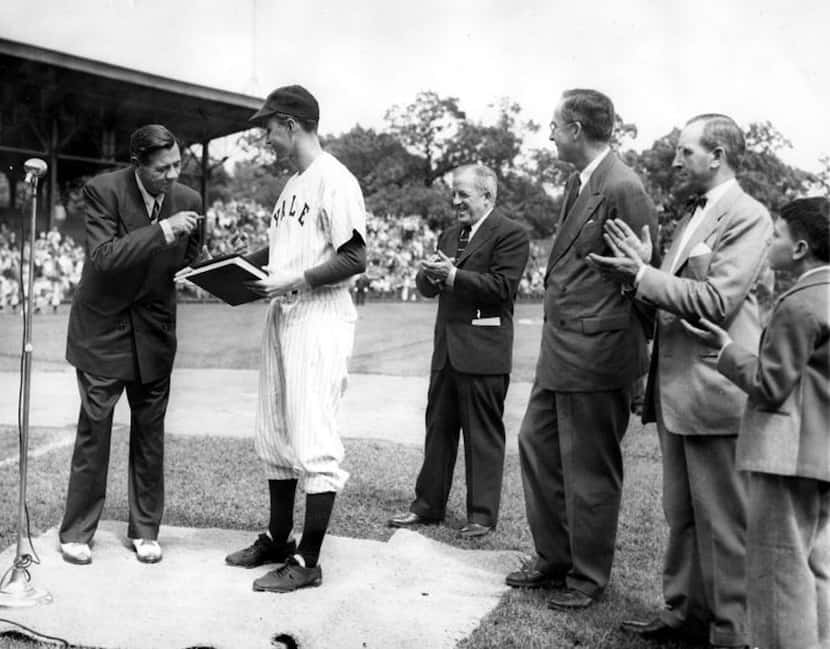 1948: Baseball legend Babe Ruth (left) presents his papers to Yale University, received by...