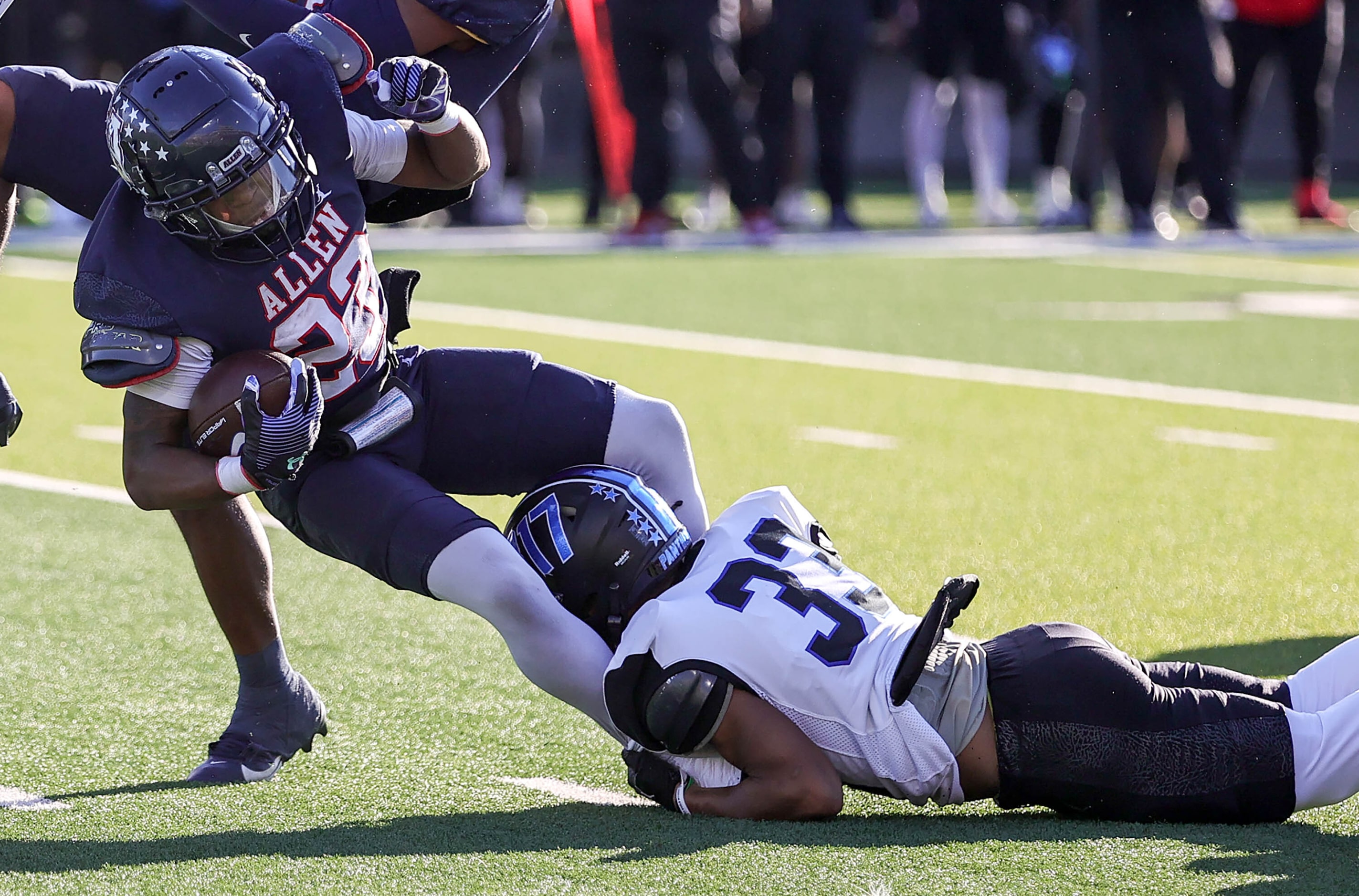 Allen running back Amir McDowell (28) is stopped for a short gain by North Crowley defensive...